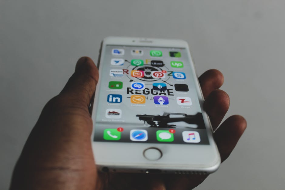 apps on mobile phone in hand